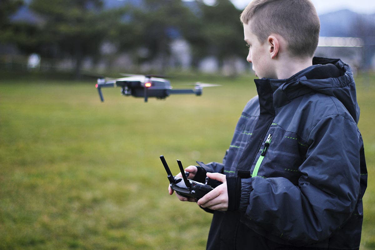 drones in education student flying drone