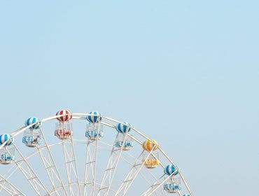 ferris wheel against blue sky negative space photography