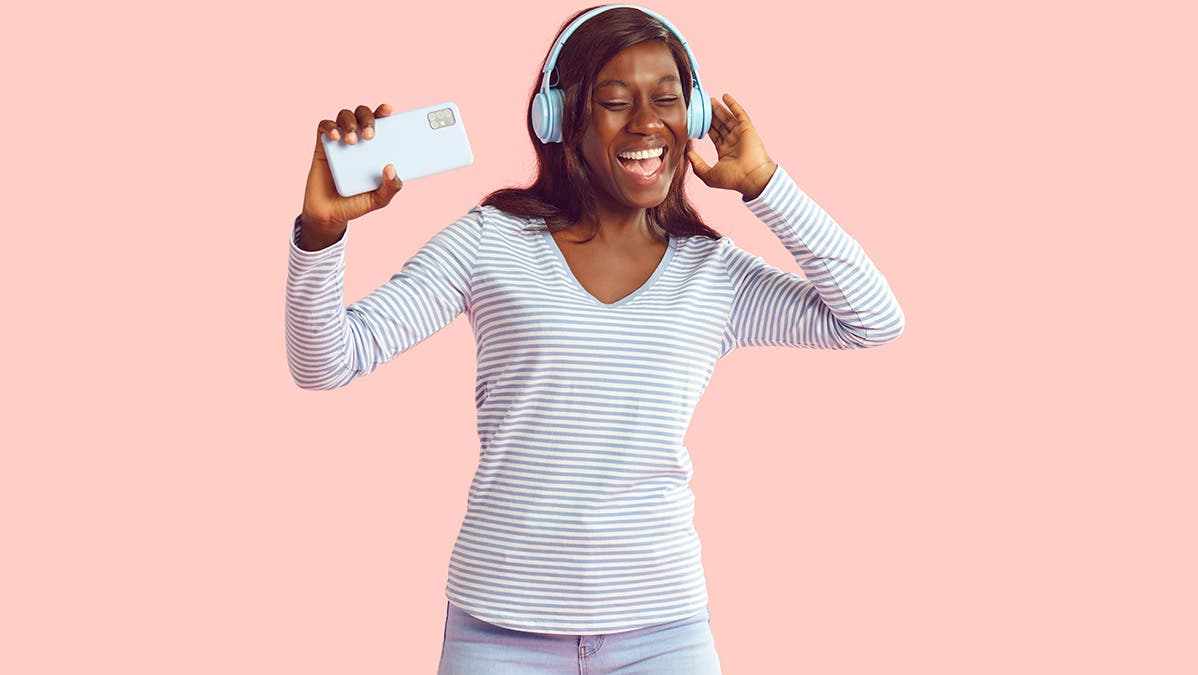 Woman listening to music on noise cancelling headphones.