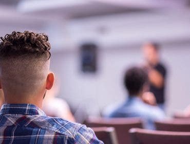 churchgoer in pew in church hearing solutions for audio