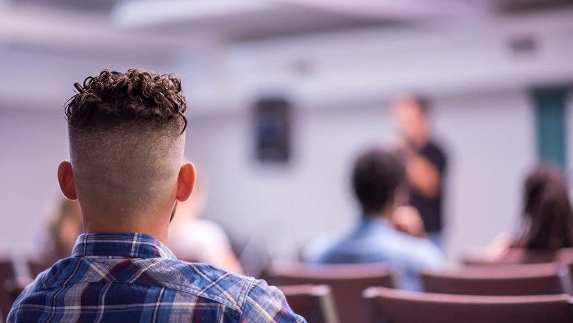 churchgoer in pew in church hearing solutions for audio