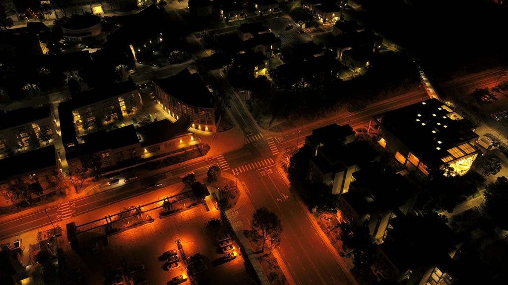 drone photography of city street at night
