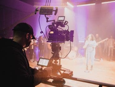 church of the highlands filmmaker capturing video footage with camera of performer