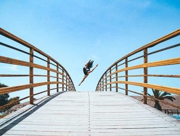 Dance photography dancer on bridge