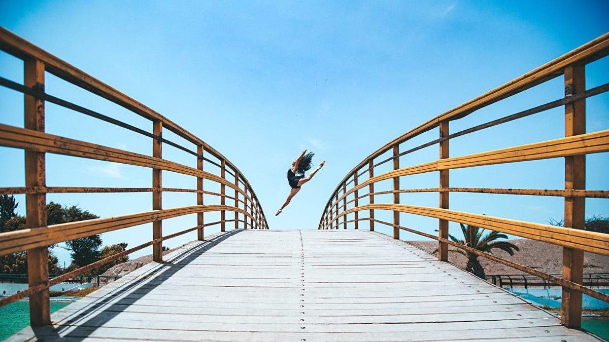Dance photography dancer on bridge