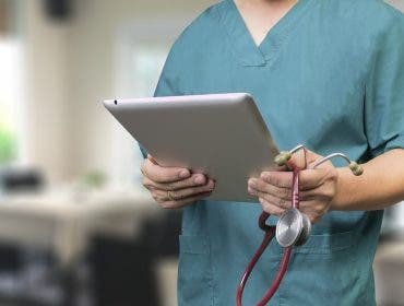 doctor practicing telemedicine with ipad