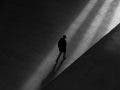 Man walking in shadows