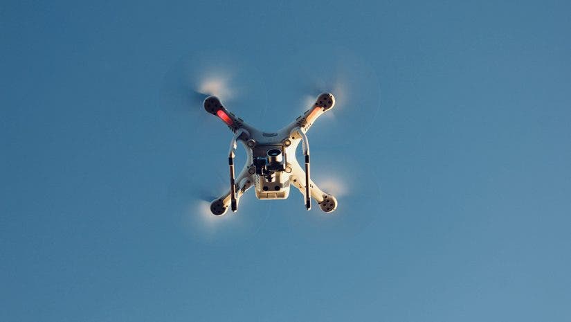 drone flying upward in sky