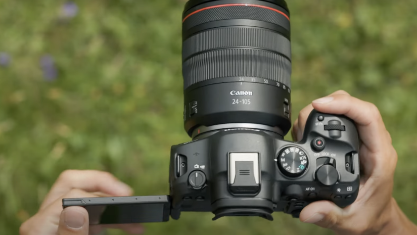 a picture of a canon camera against grass