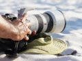 sony telephoto zoom lens on beach