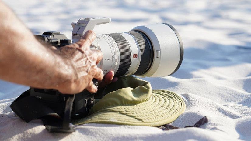 sony telephoto zoom lens on beach