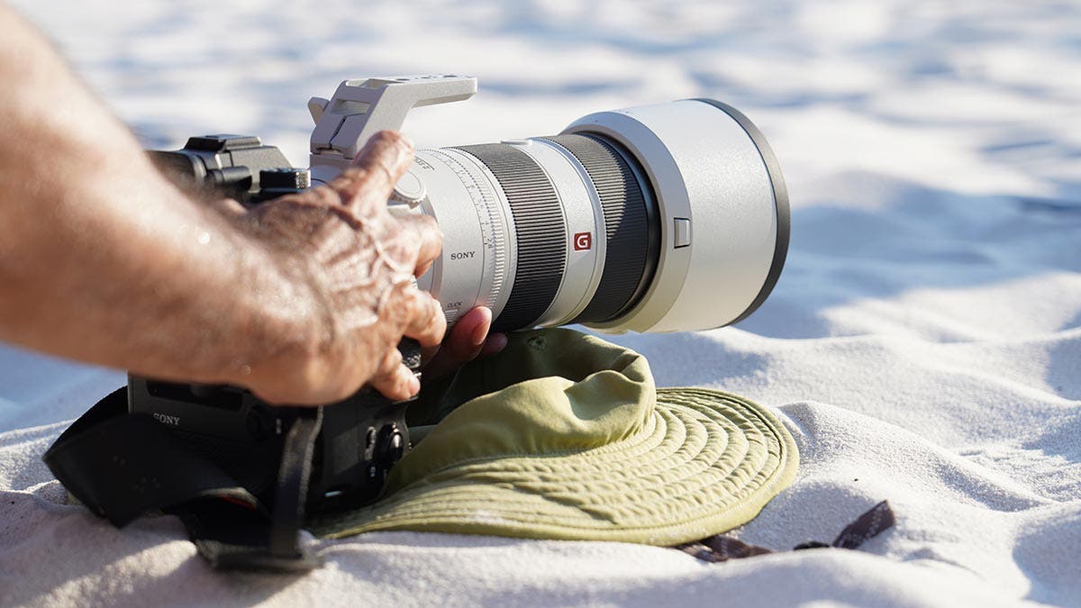 sony telephoto zoom lens on beach