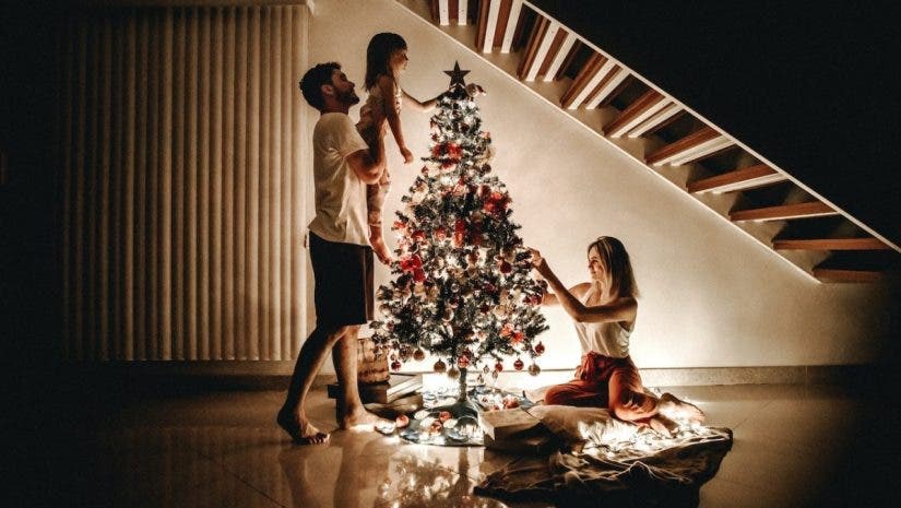 Family around Christmas tree