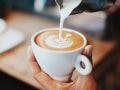 milk poured into coffee cup