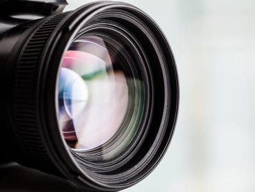 Close-up of a digital camera. Large copyspace