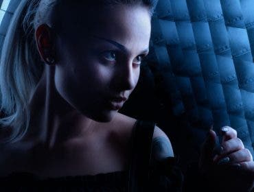 Female model between two gridded softboxes Best Portrait lens to use in studio here was 70mm