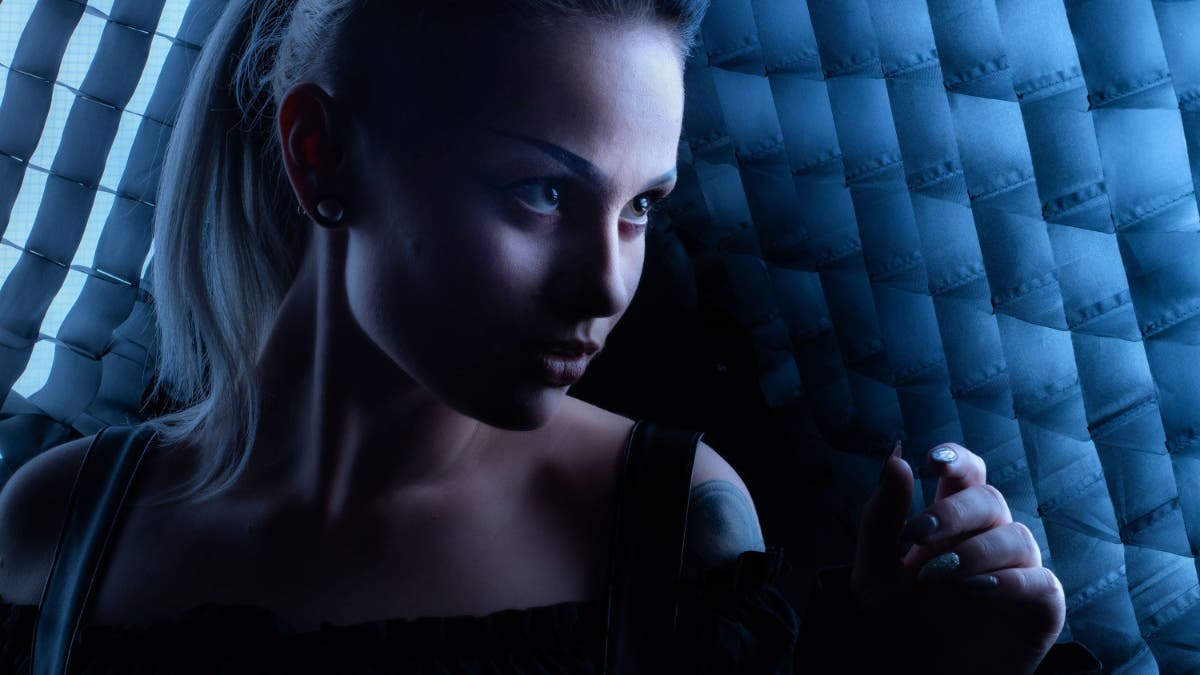 Female model between two gridded softboxes Best Portrait lens to use in studio here was 70mm