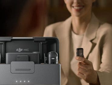 Woman holding DJI Mic 2. In foreground Mic 2 with charging case