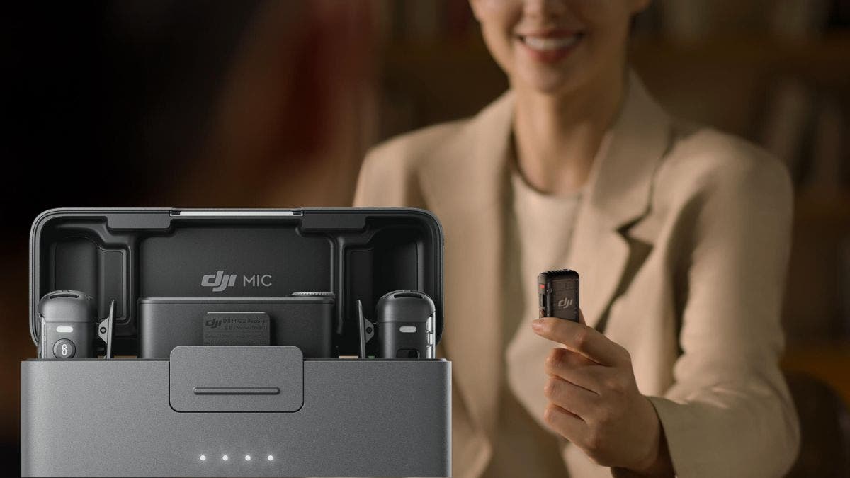 Woman holding DJI Mic 2. In foreground Mic 2 with charging case