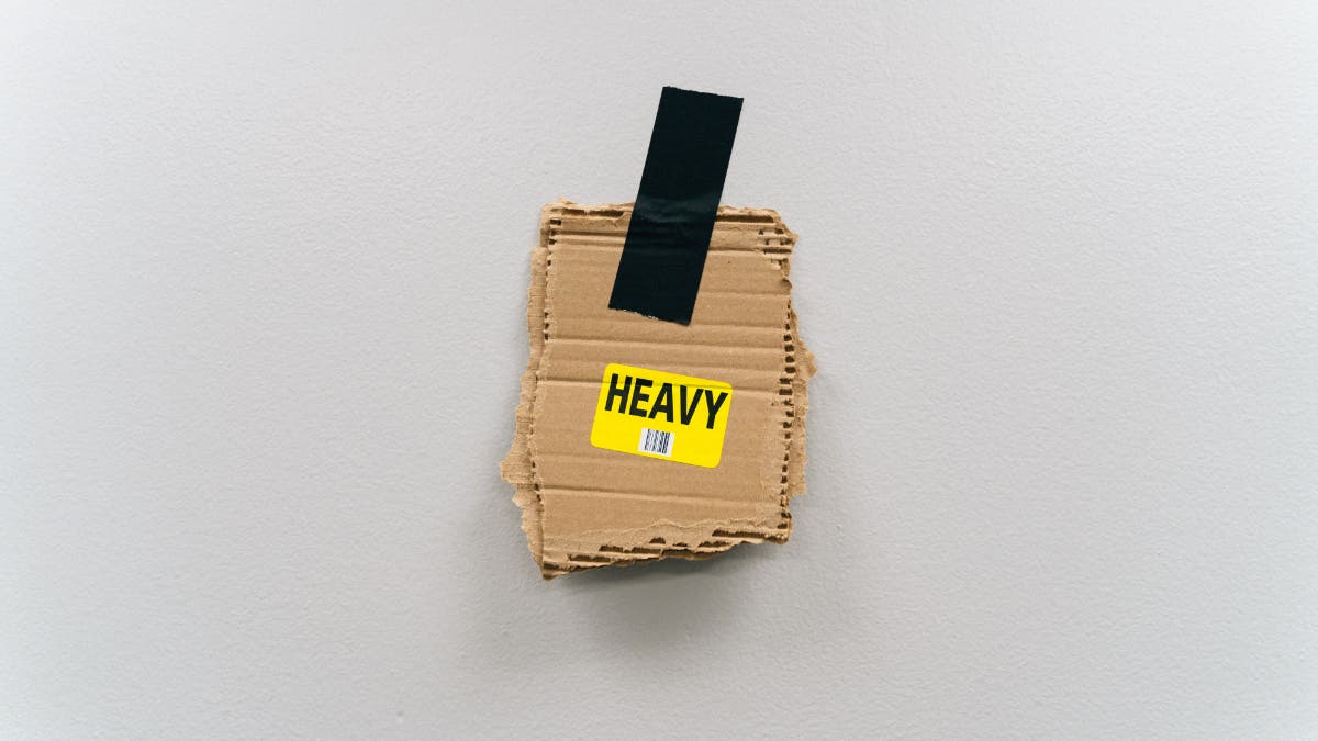 "heavy" object held to a wall with gaffer tape