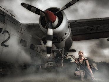 A female model crouched near the propeller of an airplane