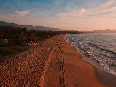 drone advertising over a beach by alex jumper via unsplash