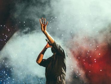 man with wireless microphone on stage
