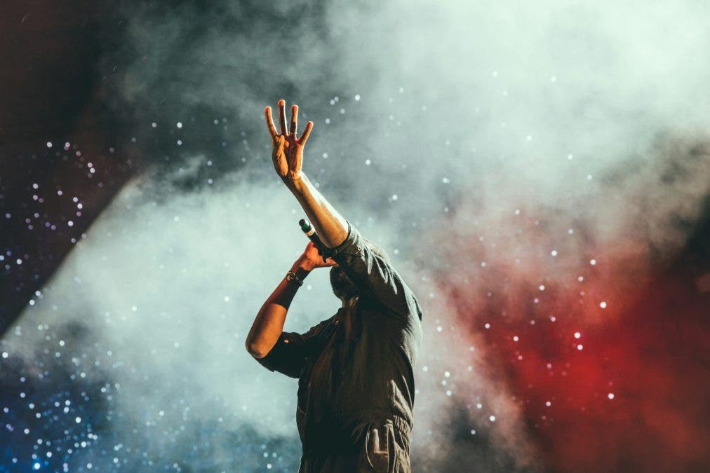 man with wireless microphone on stage