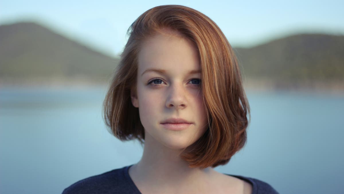A portrait in front of a landscape shot in landscape orientation