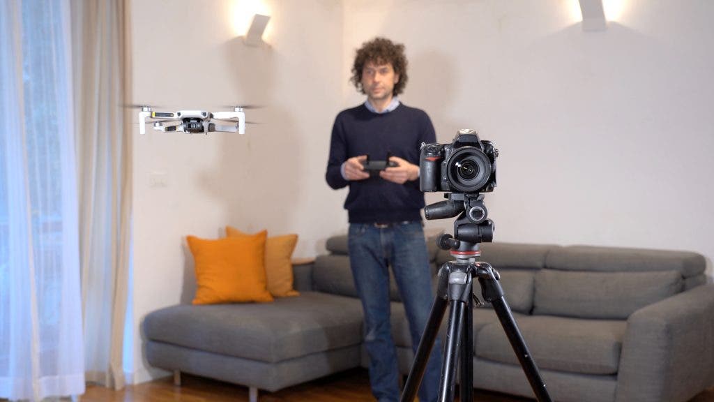 A photographer uses a drone for surveying, photography and video of apartment and building interiors - real estate and home staging for real estate drone photography
