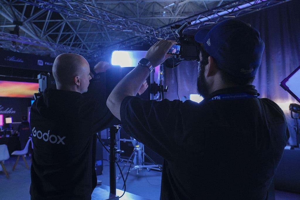 Image of Fernando Martinez getting b-roll of the Godox booth at the IBC2024 trade show by Cristina Santelises