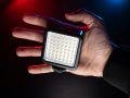 small video light on the palm of a videographer