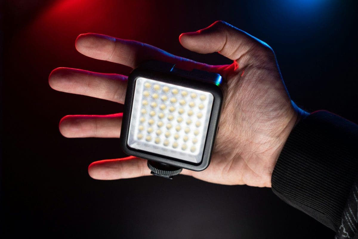small video light on the palm of a videographer
