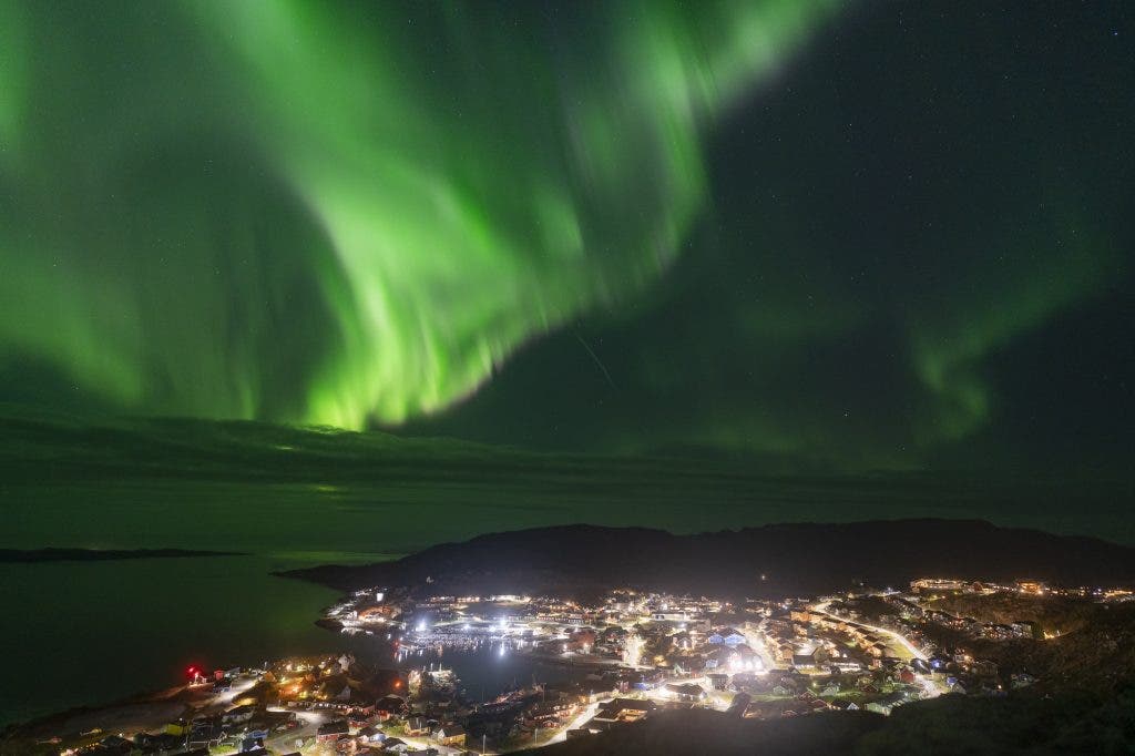 Solo travel photography example of northern lights in Qaqortoq Greenland