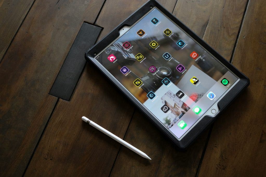 a photo of an iPad beside an apple pencil