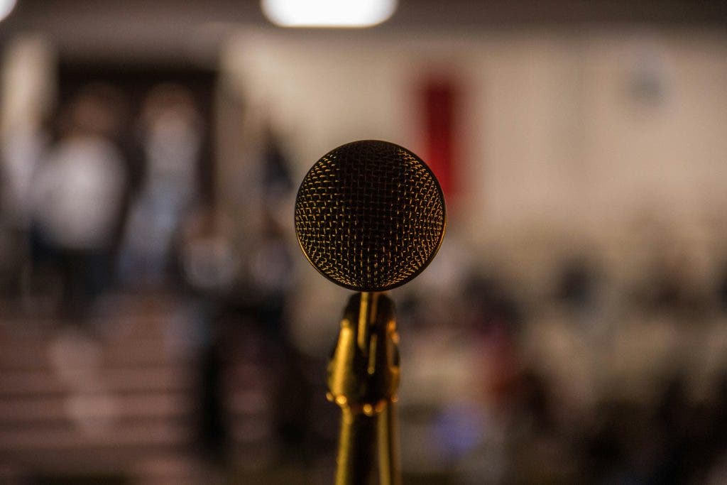 a Sennheiser microphone facing the camera
