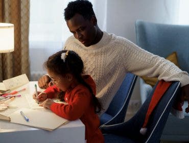 a photo of an older brother discussing the best gift ideas for siblings who love to draw