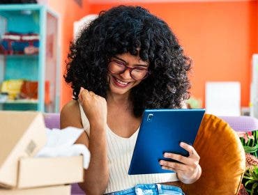 Tablet accessories help this your business owner with her commerce business from home - Female entrepreneur owns online shopping store, concepts ot home business and remote working