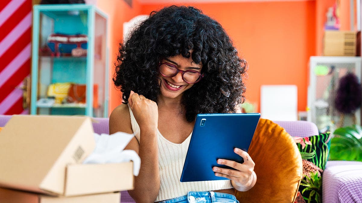 Tablet accessories help this your business owner with her commerce business from home - Female entrepreneur owns online shopping store, concepts ot home business and remote working