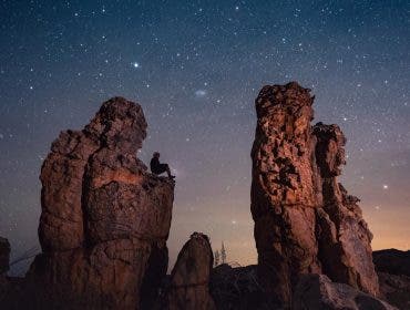 Kamran Climbs at rock in the Cederberg Mountains.jpg "A Seat Among the Stars: Embracing the Universe"  (we took this image with a 14mm f1.8 Sony lens and Sony fx3)