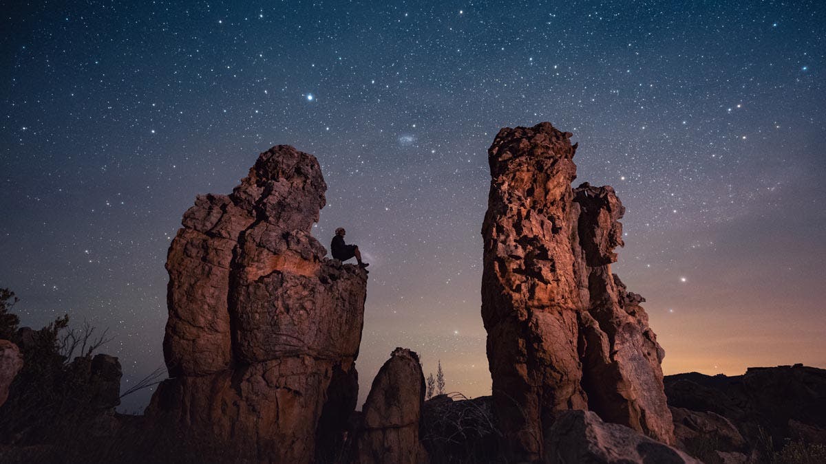 Kamran Climbs at rock in the Cederberg Mountains.jpg "A Seat Among the Stars: Embracing the Universe"  (we took this image with a 14mm f1.8 Sony lens and Sony fx3)