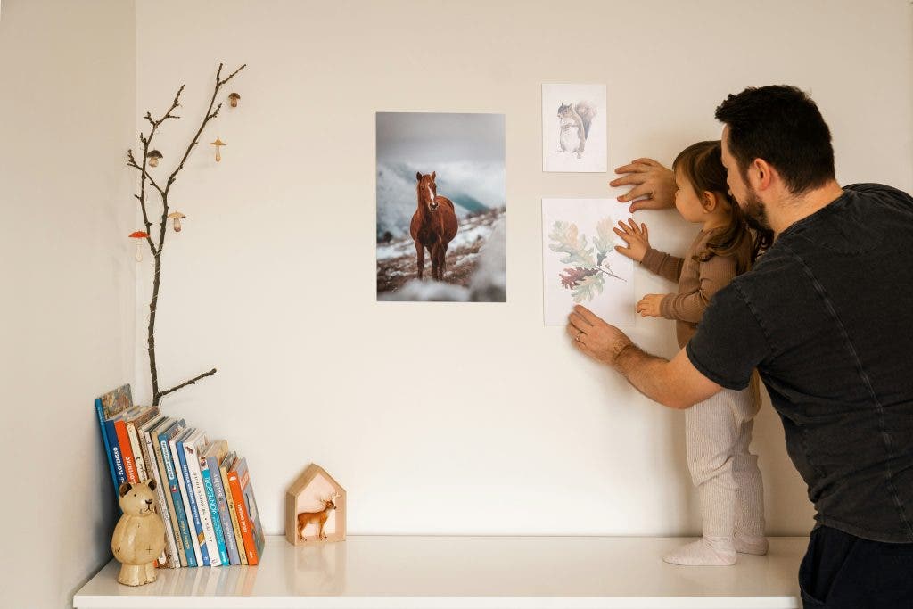 a photo print on the wall, home decor put up by family