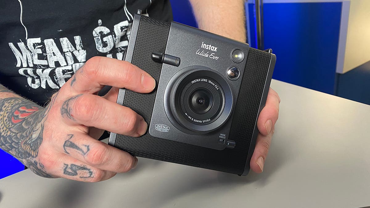 Seth holding the FUJIFILM Instax Wide Evo