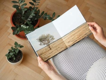 a photo of a woman holding one of her photobooks 2024