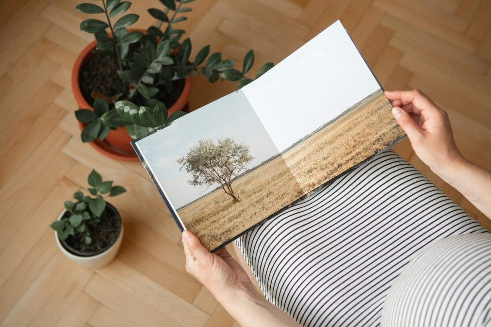 a photo of a woman holding one of her photobooks 2024