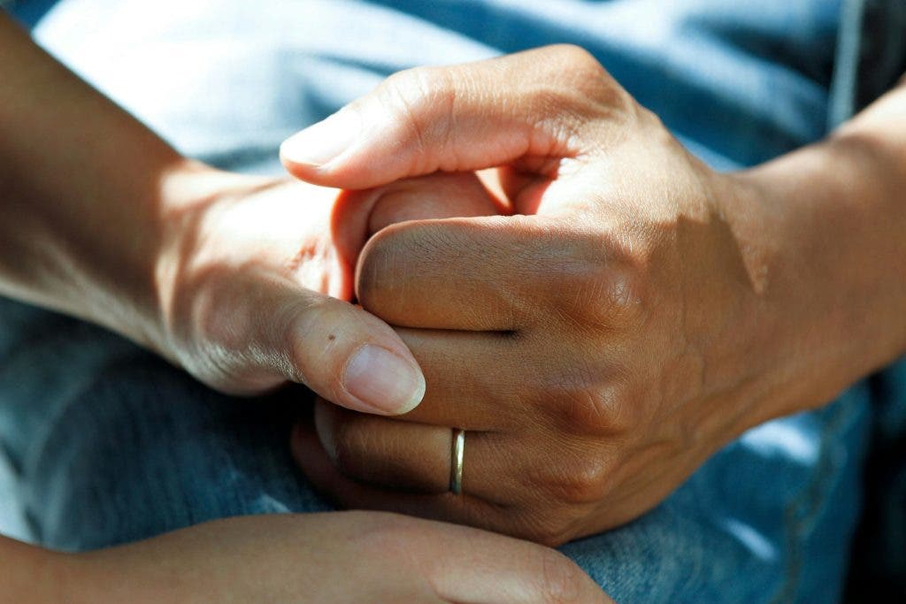 people holding hands in self-care