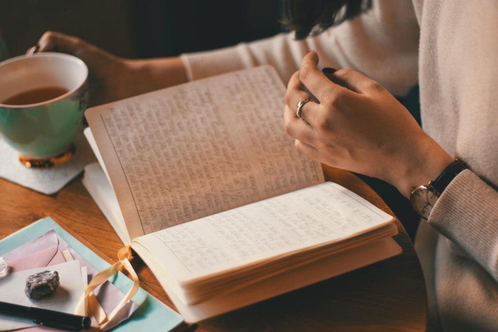 a person journaling as a practice of self-care