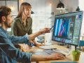 Female Art Director Consults Designer Colleague working on a Portrait using a Photo Editing Software. By Gorodenkoff on Adobe Stock
