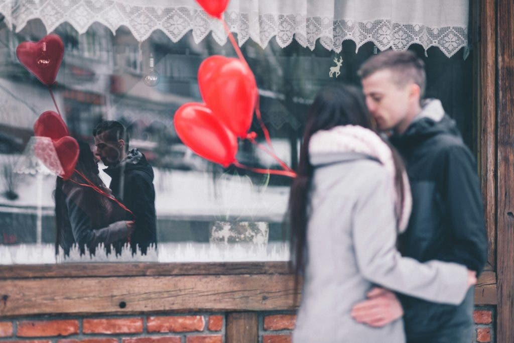 a couple taking photos on Valentine's Day