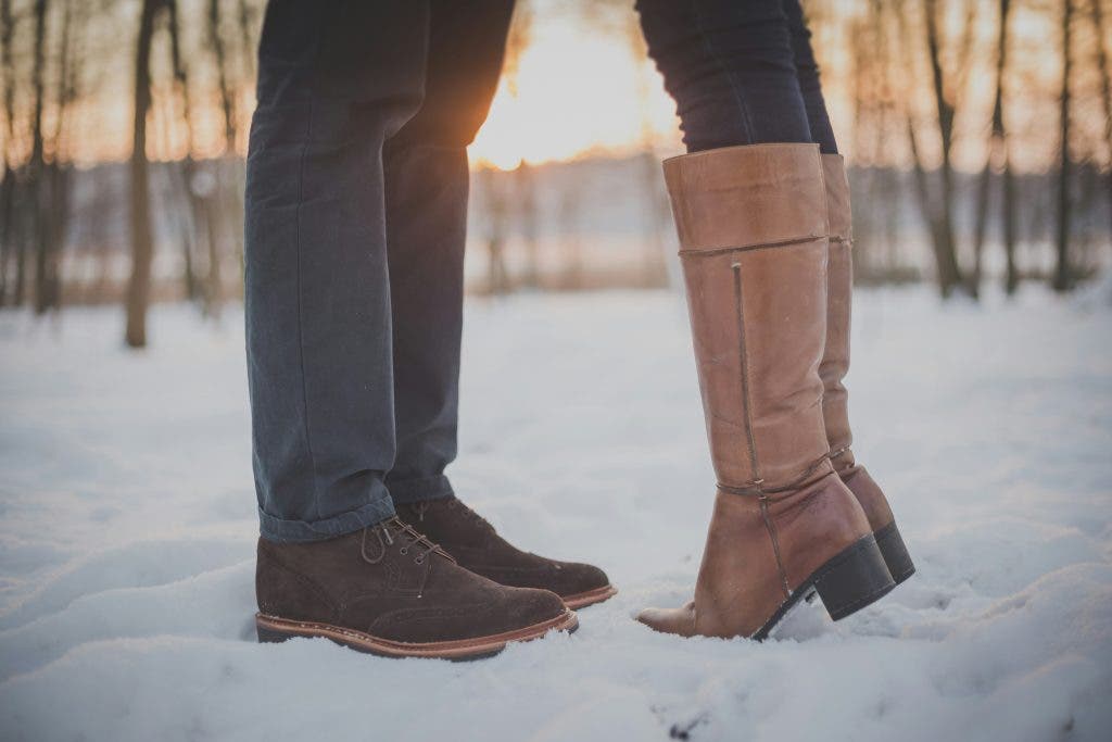 two lovers and their shoes in the snow